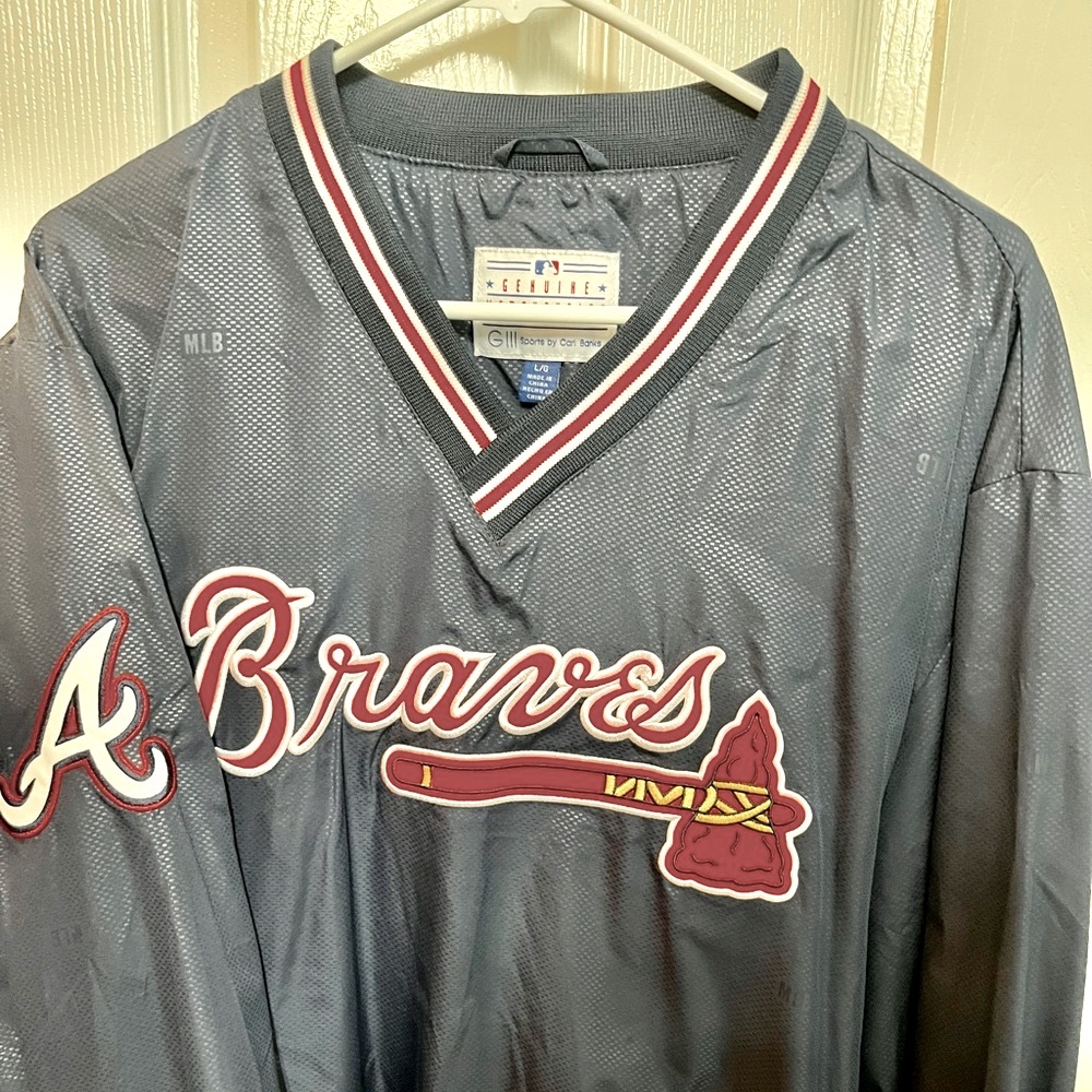 Braves warmup jacket.Never worn. Size Large